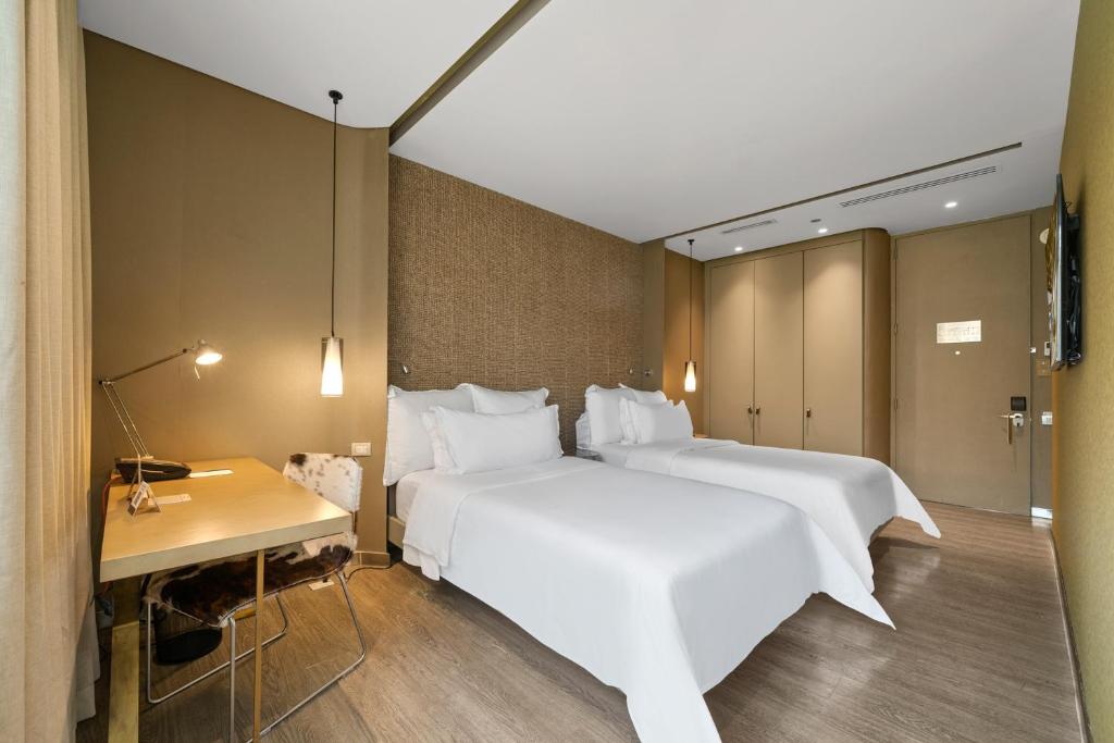Postel nebo postele na pokoji v ubytování BOG Hotel
