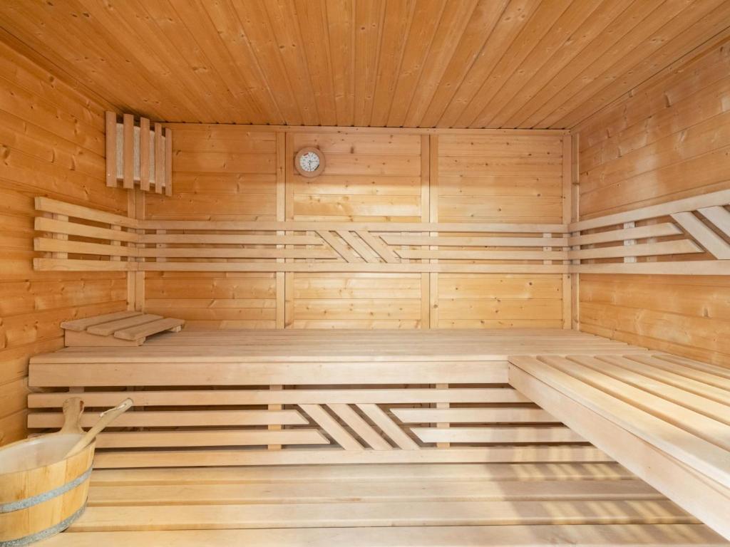 a sauna with wooden walls and a wooden ceiling at Haus Lilyan in Donnersbachwald