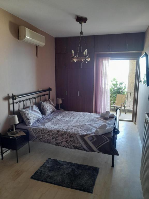 En eller flere senge i et værelse på ΕΞΟΧΙΚΗ ΚΑΤΟΙΚΙΑ