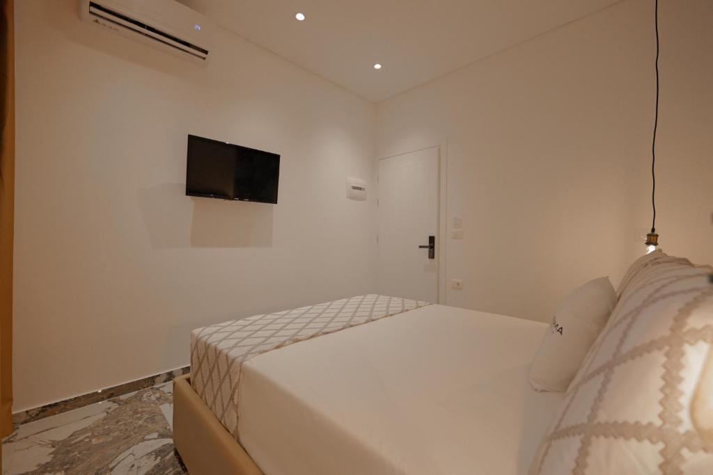 Uma cama ou camas num quarto em Siro Kerma Private Beach Villa