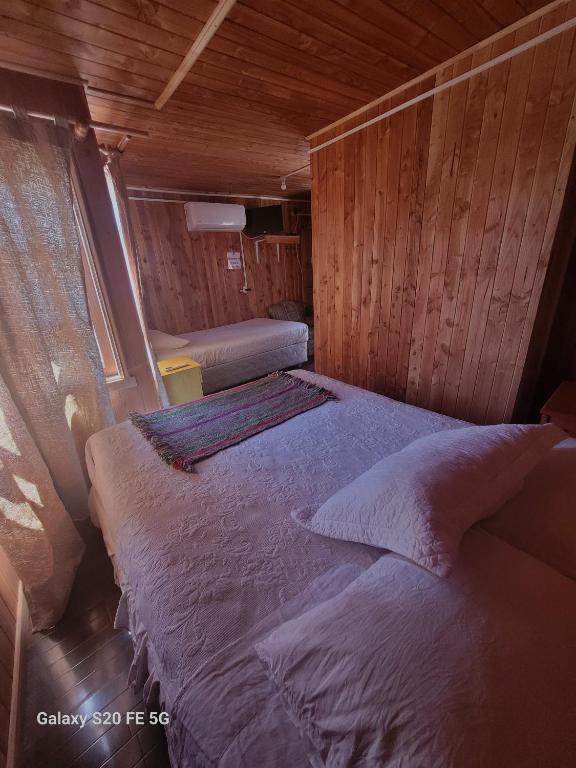 Postel nebo postele na pokoji v ubytování Alojamientos La Casita del Centro