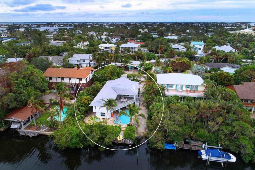 an aerial view of a house on an island in the water at Surrounded By Sea Breezes - Anna Maria, FL in Anna Maria
