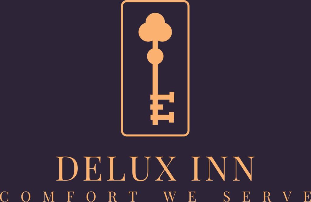 a sign for the deluva inn concurrent seveneeneen istg istg istg istg at Delux Inn in Macon