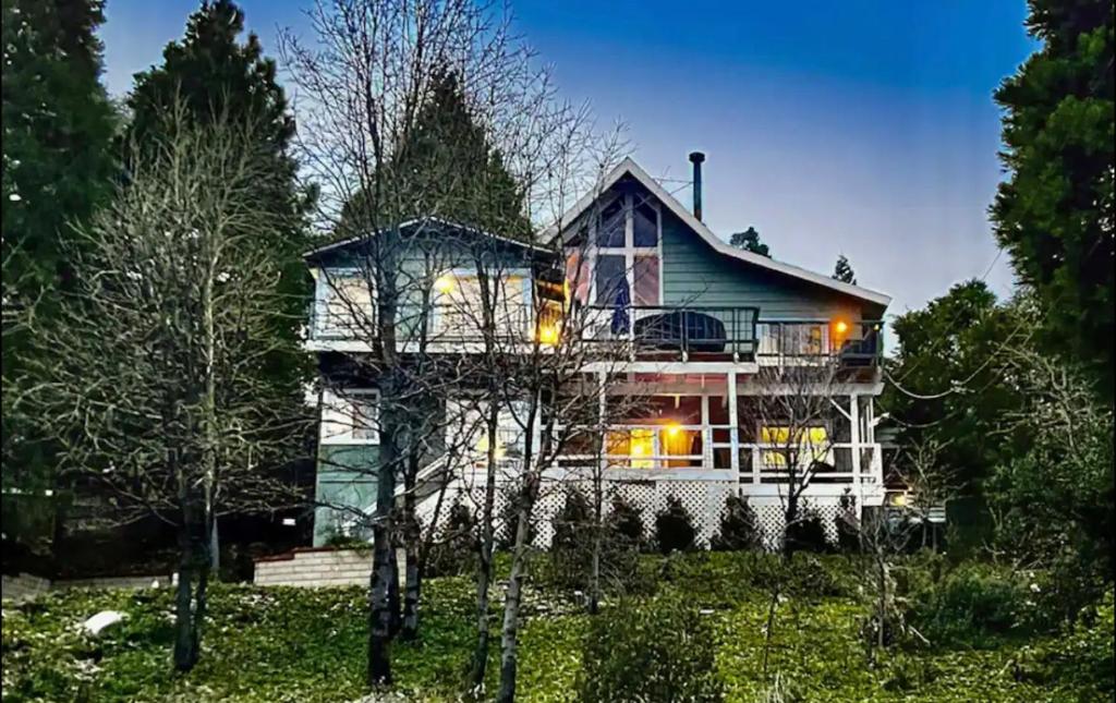 a large house with lights in front of it at Lakeview Ridge+ lake view + Balcony’s + Game Room in Lake Arrowhead