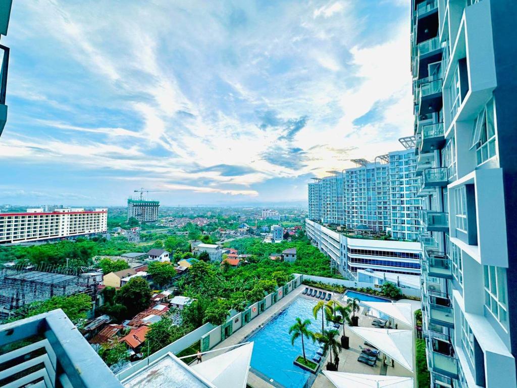 a view of a city from a building at 8 Newtown Boulevard by Hiverooms in Lapu Lapu City