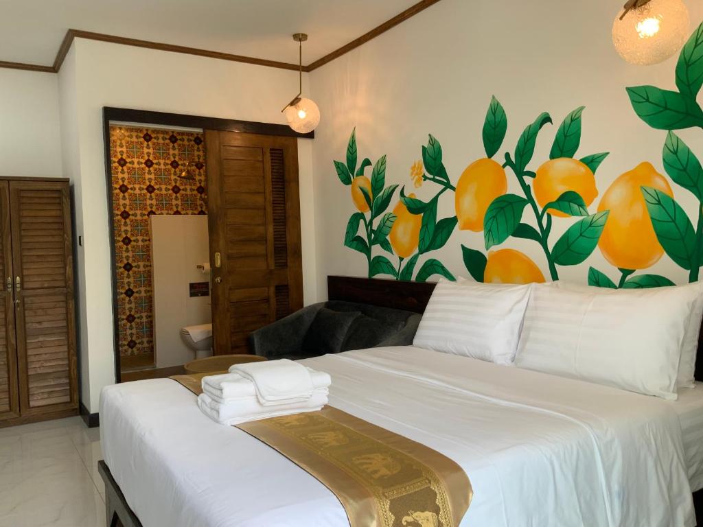 Postel nebo postele na pokoji v ubytování Lemon Guesthouse