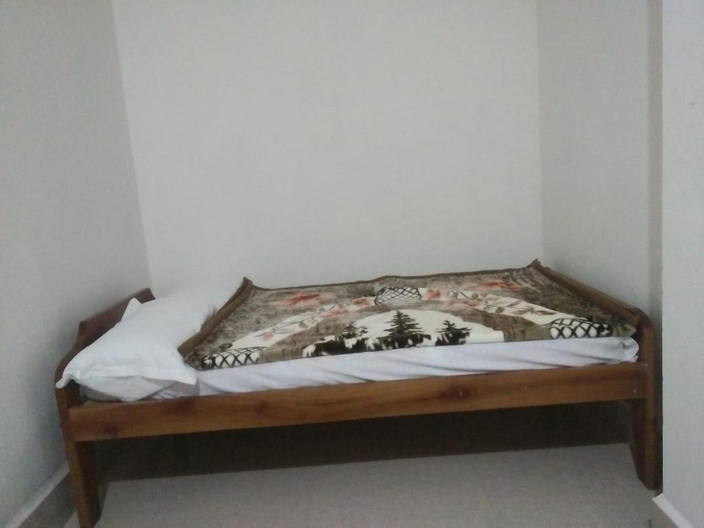 Postel nebo postele na pokoji v ubytování Pine Tree Lodge