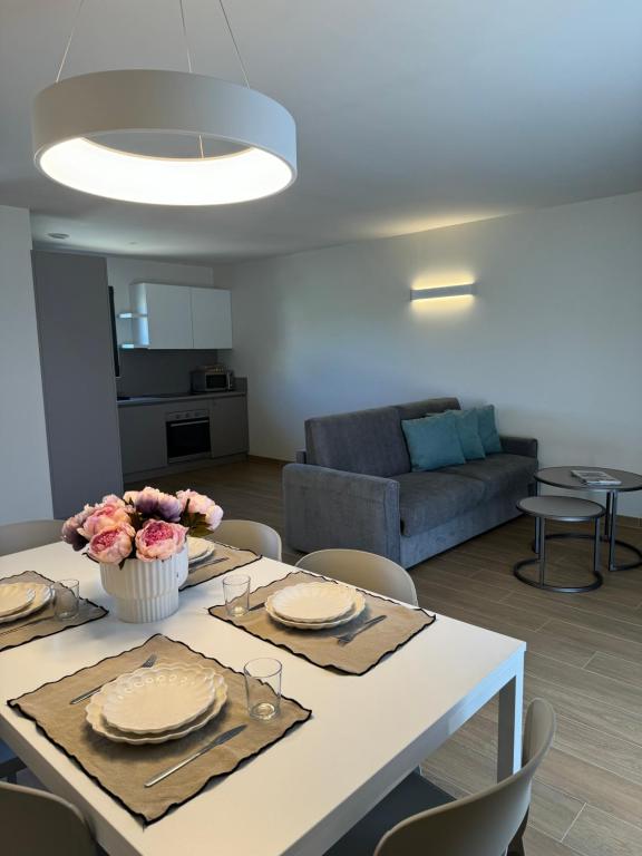 a living room with a table and a couch at Résidence CATALINA in Saint-Florent