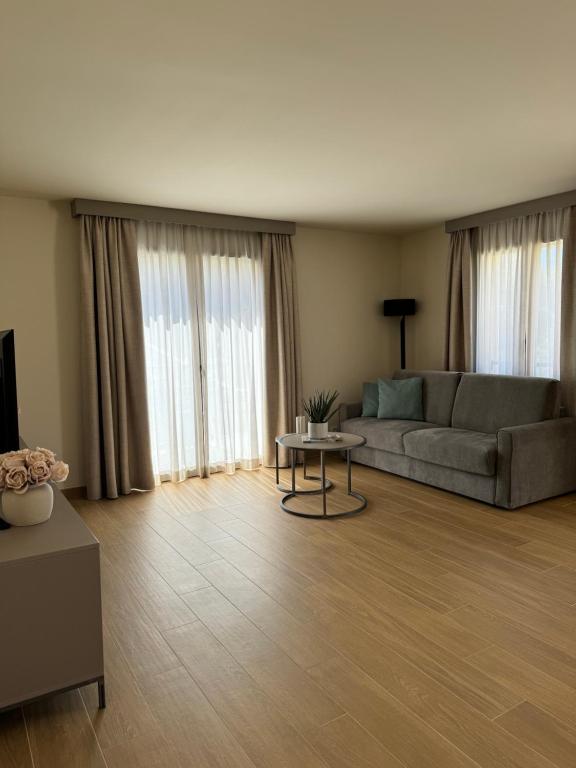 a living room with a couch and a table at Résidence CATALINA in Saint-Florent