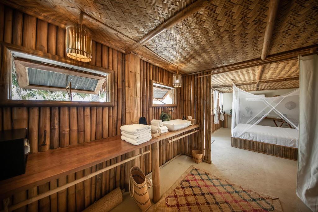 Postel nebo postele na pokoji v ubytování The Beach House Ocam Ocam