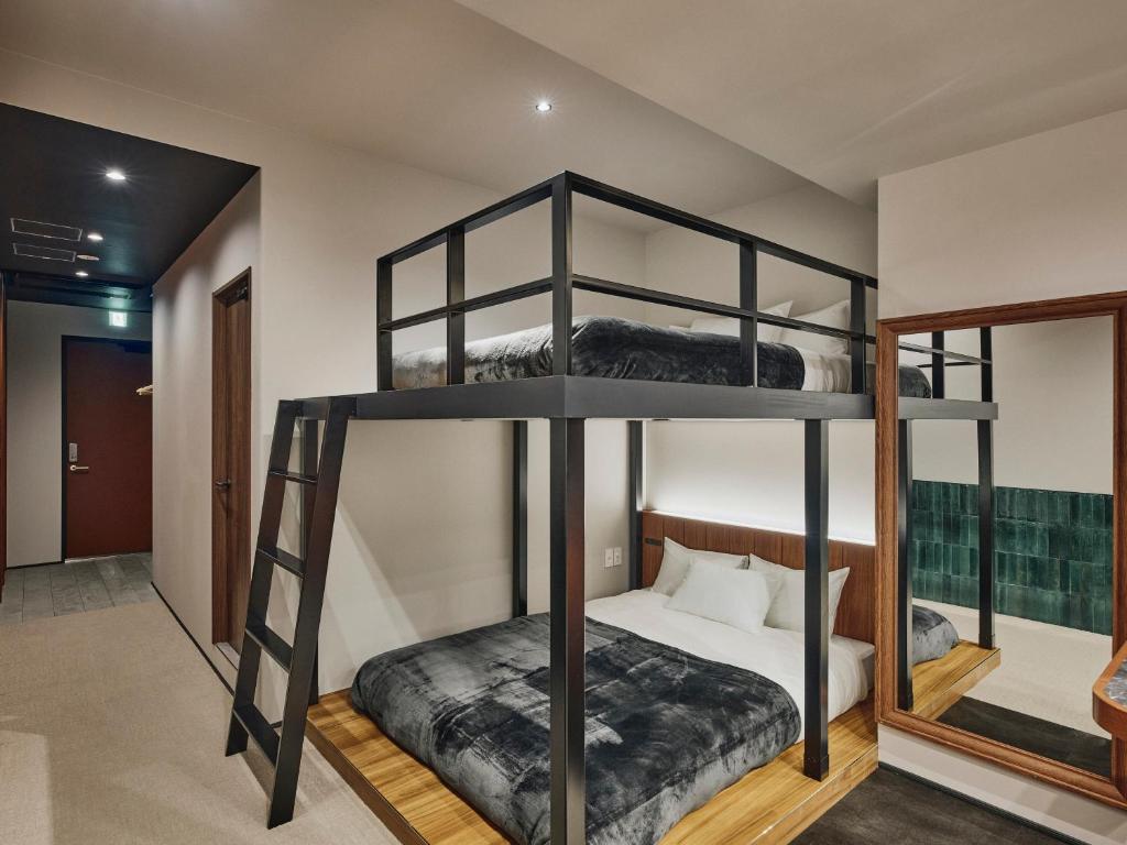 Postel nebo postele na pokoji v ubytování illi Enu Yotsuya
