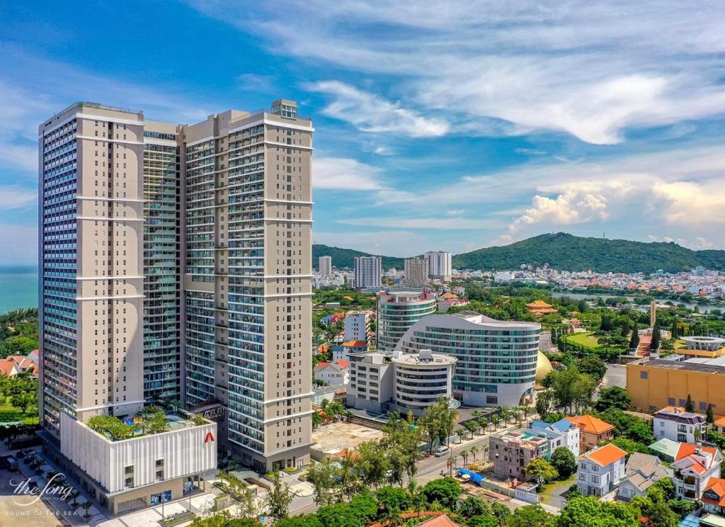 an aerial view of a city with tall buildings at Căn Hộ Ban Công Hướng Biển - FREE HỒ BƠI VÔ CỰC - The Sóng Vũng Tàu in Vung Tau