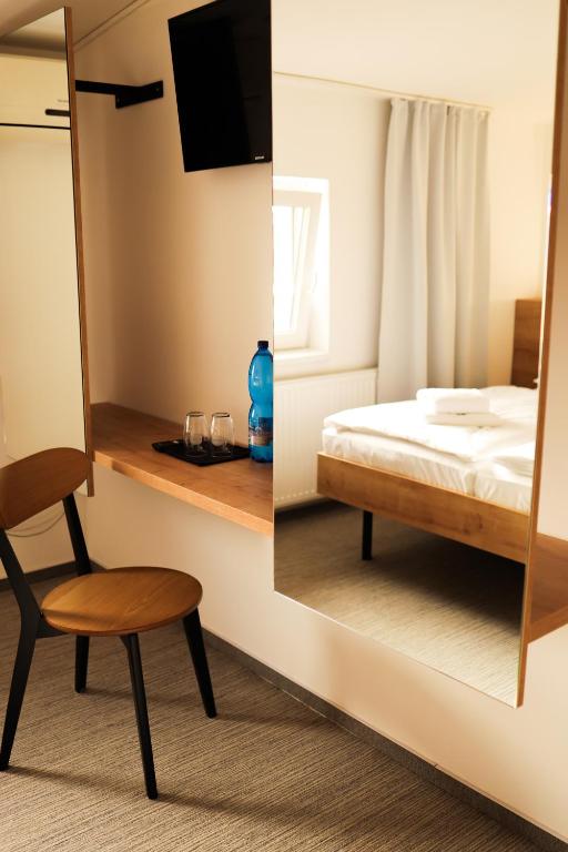Postel nebo postele na pokoji v ubytování Golden Golem hotel & Spa