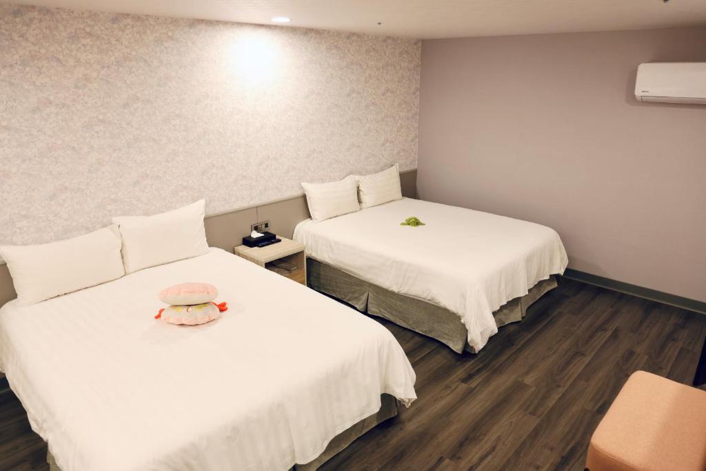 Postel nebo postele na pokoji v ubytování 歐法行旅 O Fun Hotel