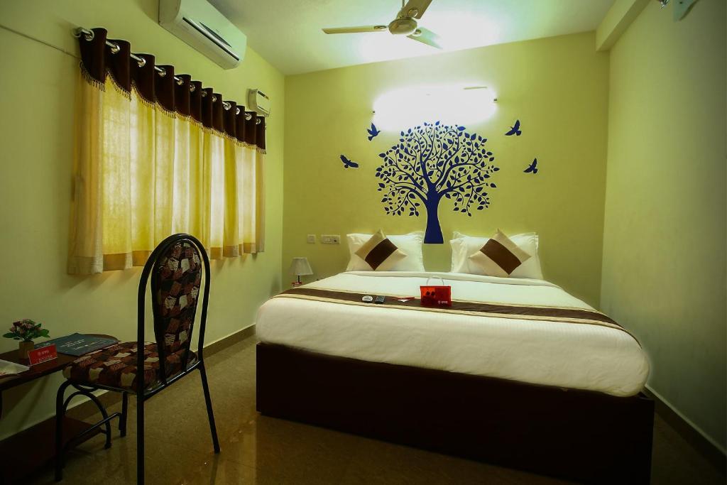 Katil atau katil-katil dalam bilik di OYO Apartment T Nagar Near Guindy National Park