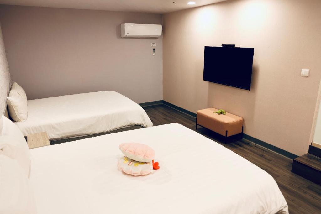 Postel nebo postele na pokoji v ubytování 歐法行旅 O Fun Hotel