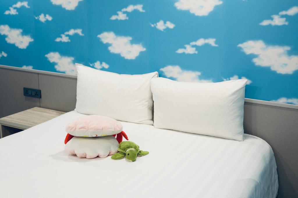Postel nebo postele na pokoji v ubytování 歐法行旅 O Fun Hotel