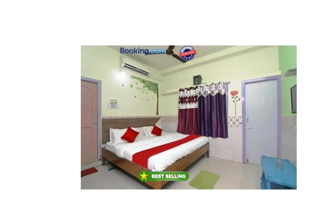 a bedroom with a bed with a red and white blanket at Goroomgo Hotel Beach Heaven Puri Near Golden Sea Beach & Swargadwar in Puri