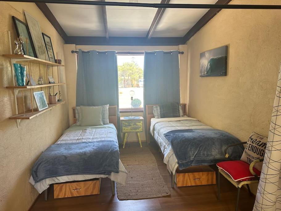 Ένα ή περισσότερα κρεβάτια σε δωμάτιο στο Ocean Dunes Holiday Home