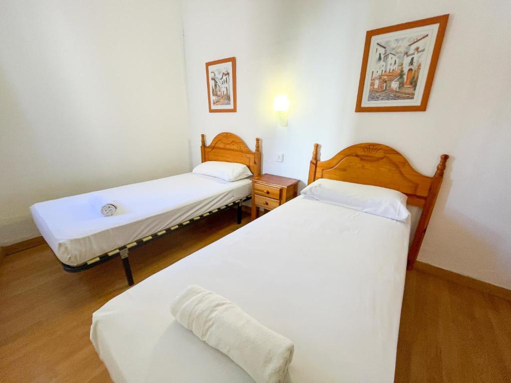 Posteľ alebo postele v izbe v ubytovaní Bungalows Pescador 3000