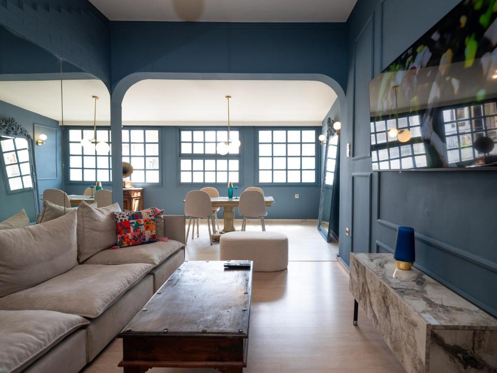 a living room with a couch and a table at Loft 038 City Center in Heraklio Town