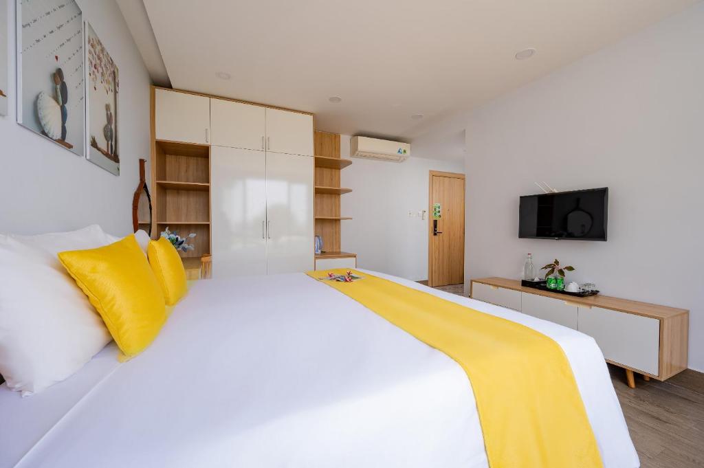 Giường trong phòng chung tại LASANTA Villa