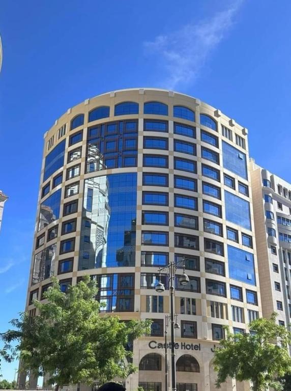 a large office building with a lot of windows at Castle Hotel in Medina