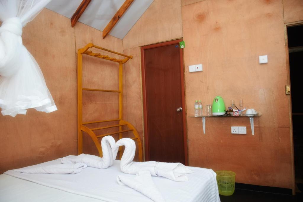 Postel nebo postele na pokoji v ubytování Akash Treehouse