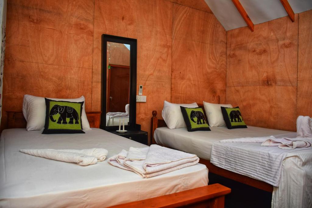 Postel nebo postele na pokoji v ubytování Akash Treehouse