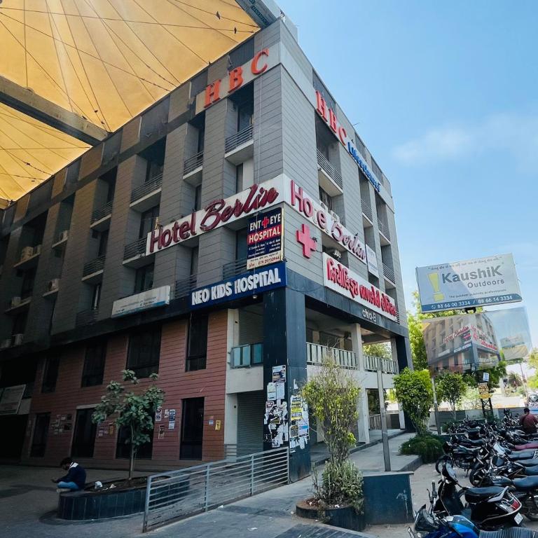 a building with motorcycles parked in front of it at The Berlin in Gandhinagar