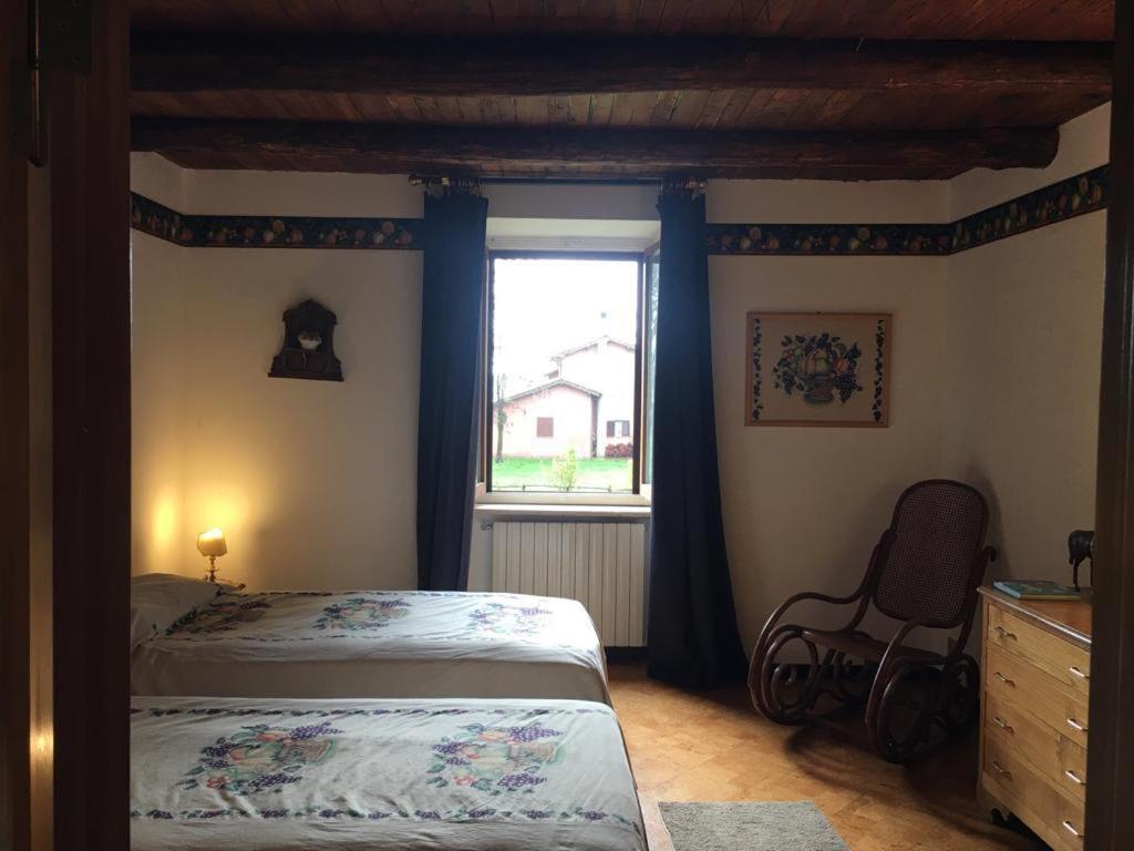 a bedroom with a bed and a window at Colle Rampo in Colleferro