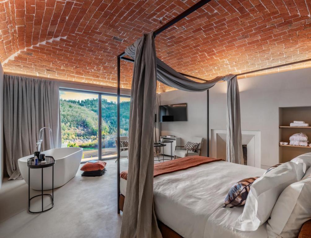 Postel nebo postele na pokoji v ubytování Relais Dal Cavaliere