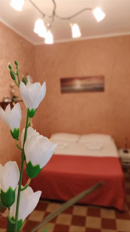 A bed or beds in a room at Ruggero House