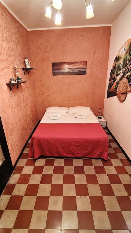 A bed or beds in a room at Ruggero House