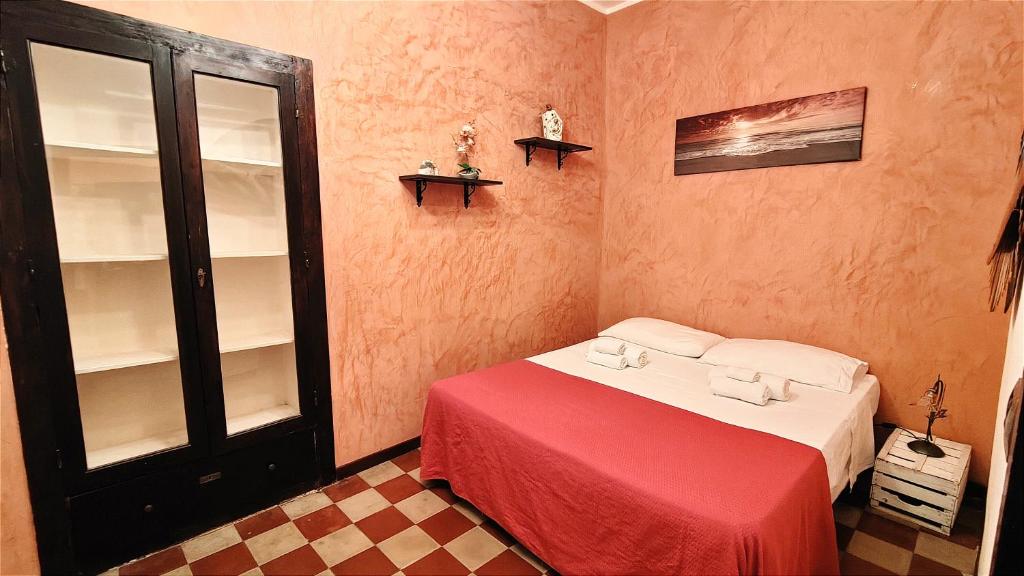 A bed or beds in a room at Ruggero House