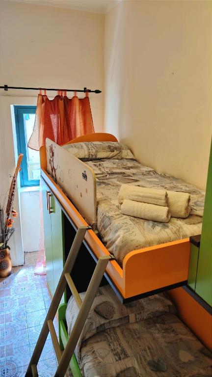 A bed or beds in a room at Ruggero House