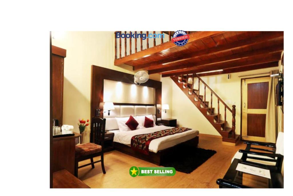 a bedroom with a bed and a stair case at Hotel Moon The Luxury Palace - Nainital in Nainital