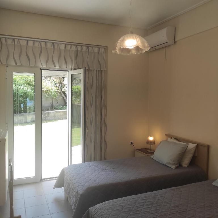 Postel nebo postele na pokoji v ubytování Sea Breeze Villa