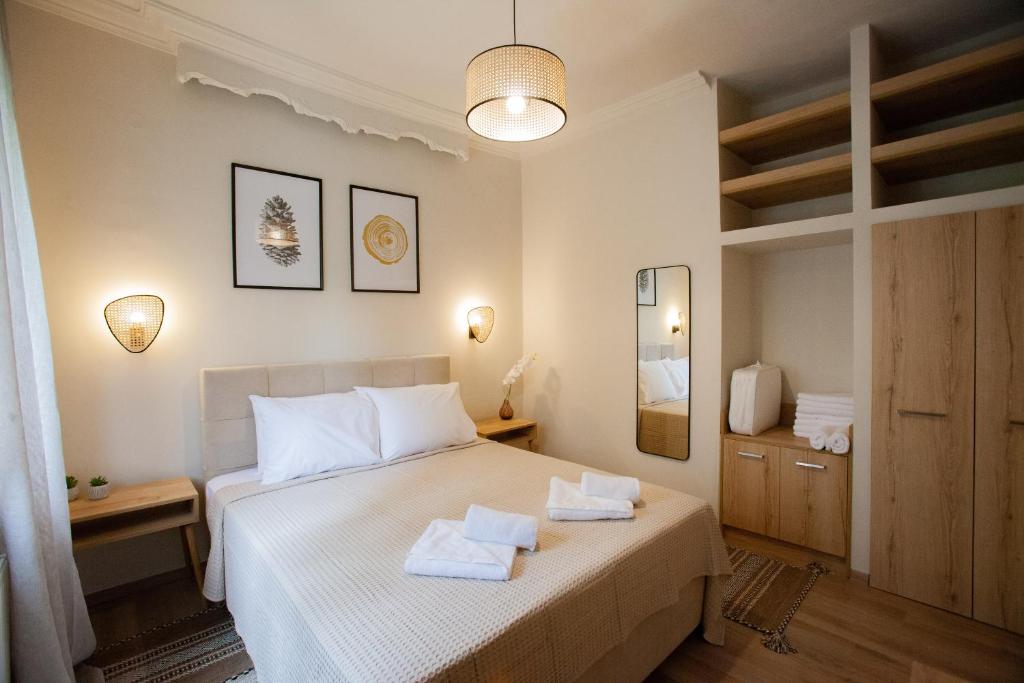 Ένα ή περισσότερα κρεβάτια σε δωμάτιο στο DayDin Apartments - Day Kastoria