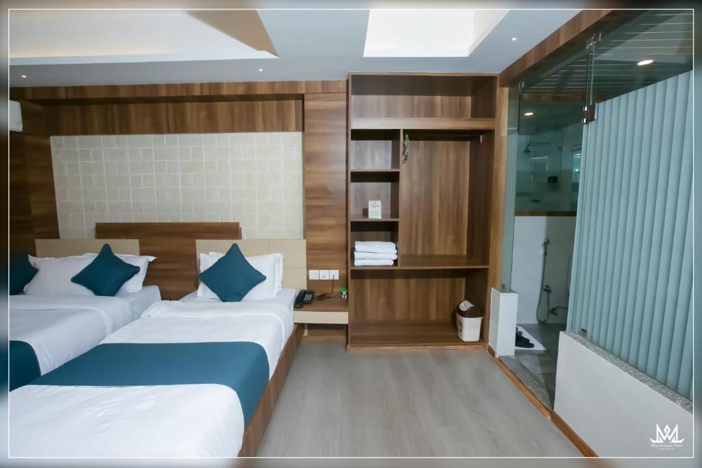 Postel nebo postele na pokoji v ubytování Hotel Maya Boutique & Apartment