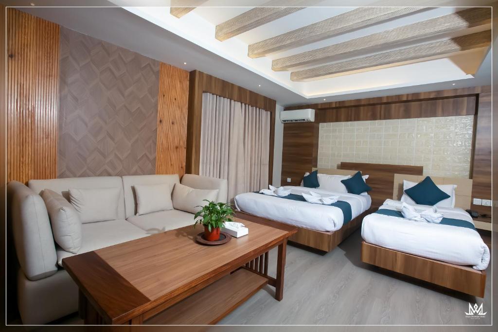 Postel nebo postele na pokoji v ubytování Hotel Maya Boutique & Apartment