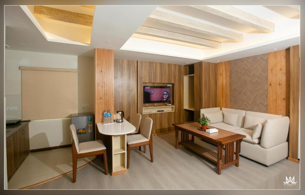 TV a/nebo společenská místnost v ubytování Hotel Maya Boutique & Apartment