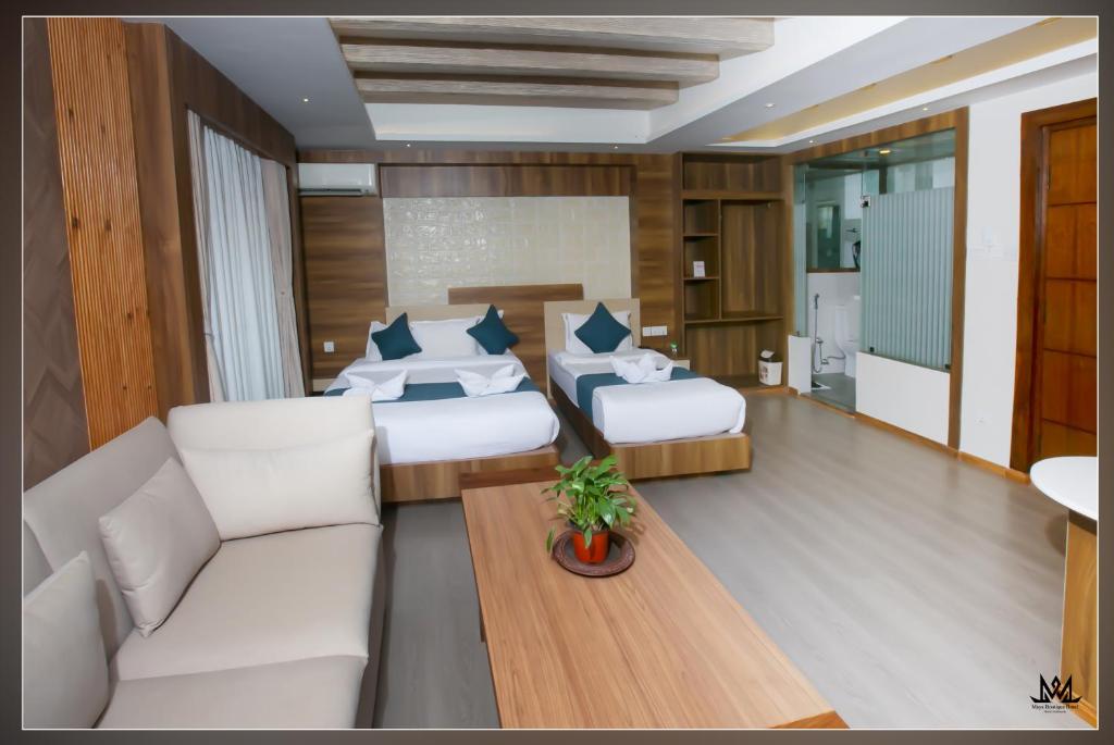 Postel nebo postele na pokoji v ubytování Hotel Maya Boutique & Apartment