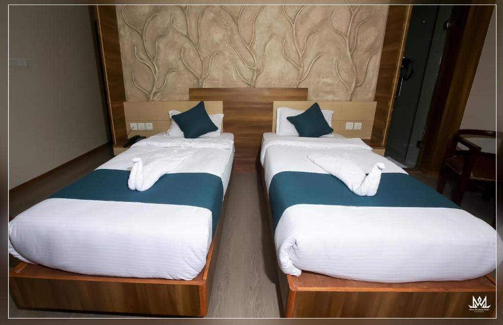 Postel nebo postele na pokoji v ubytování Hotel Maya Boutique & Apartment