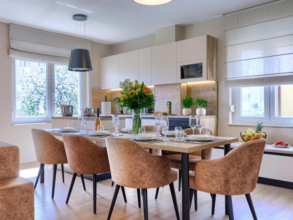 a kitchen and dining room with a table and chairs at Apartment Marina by Interhome in Novigrad Istria