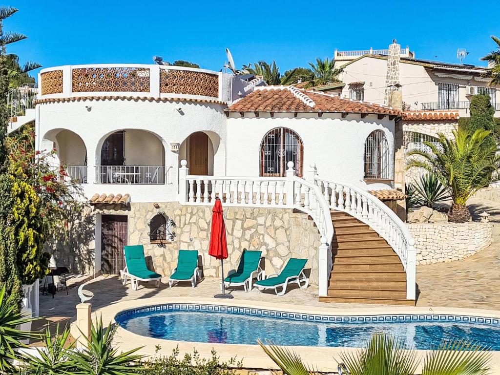a villa with a swimming pool and a house at Holiday Home Zindel by Interhome in Balcon del Mar