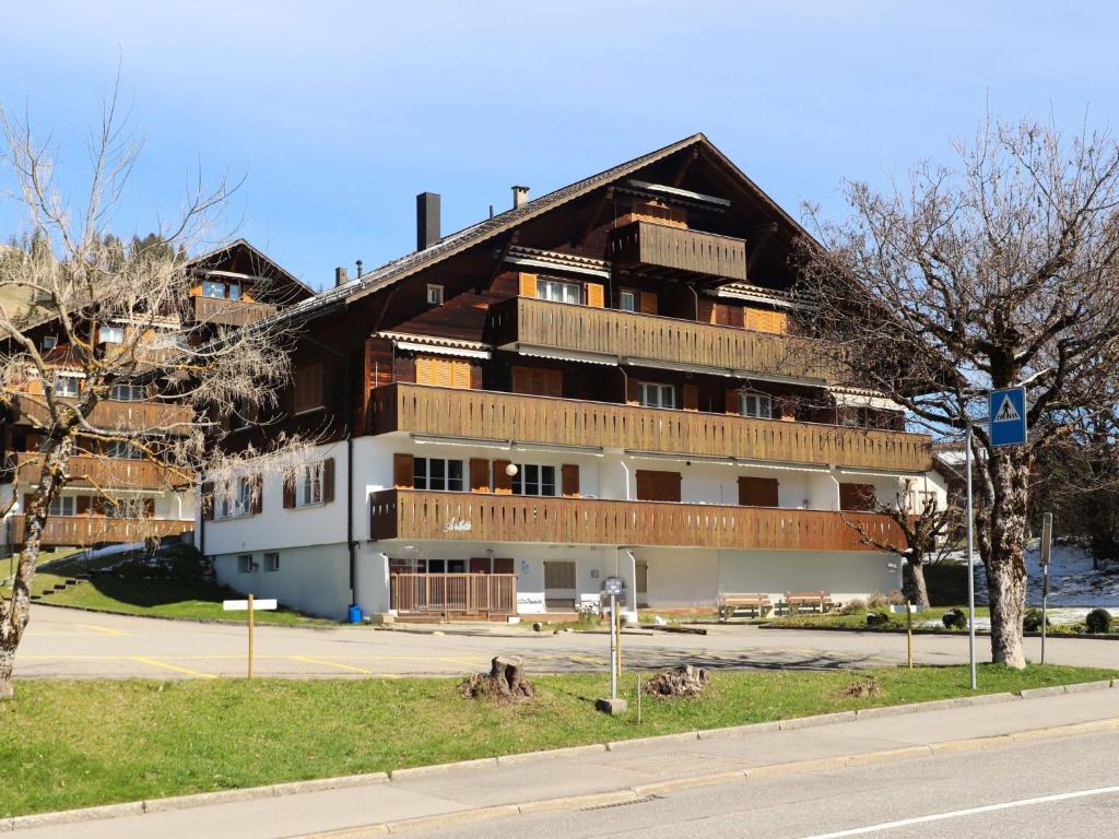 a large building on the side of a street at Apartment Arlette Nr- 34 by Interhome in Gstaad