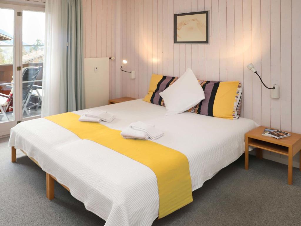 Letto o letti in una camera di Apartment Arlette Nr- 34 by Interhome