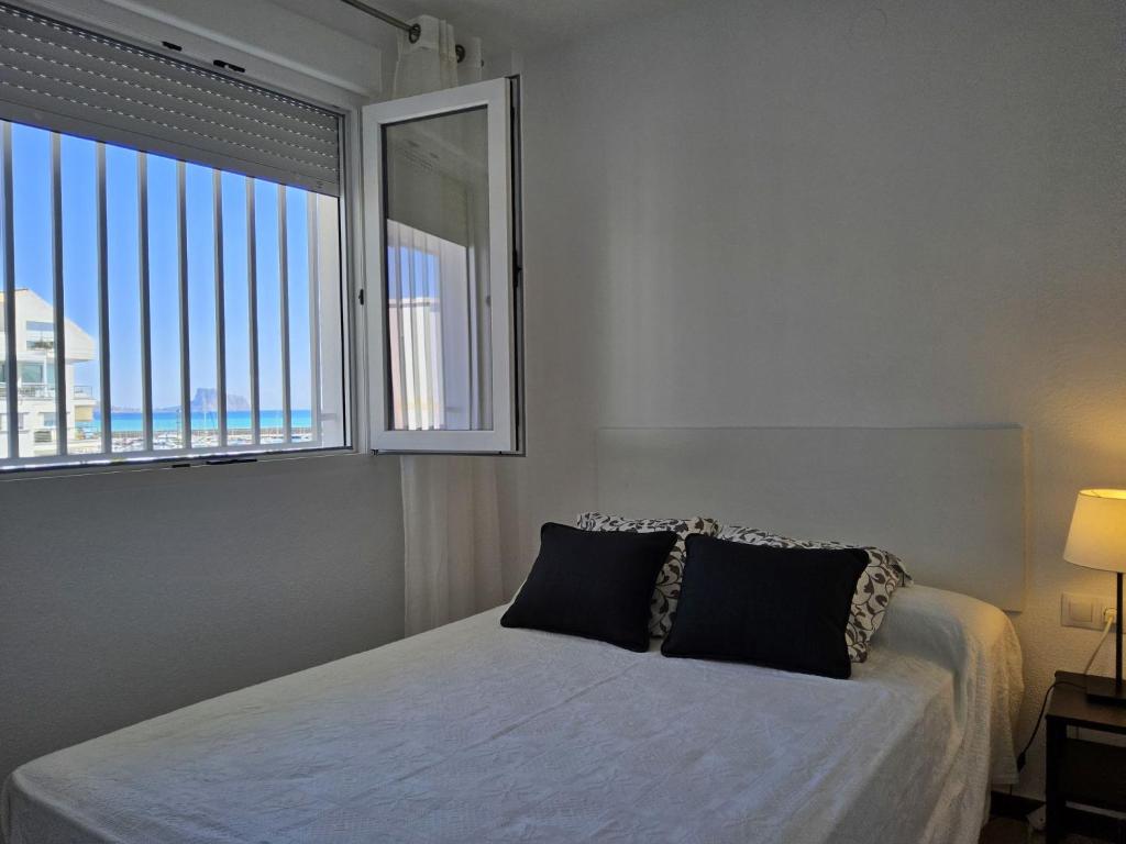 A bed or beds in a room at Apartment Sol y Mar by Interhome