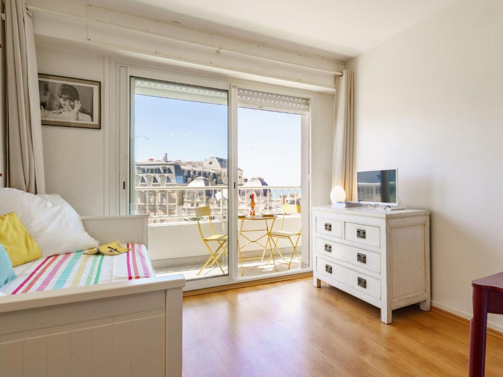 a bedroom with a bed and a window with a view at Studio Bellevue Clemenceau-2 by Interhome in Biarritz